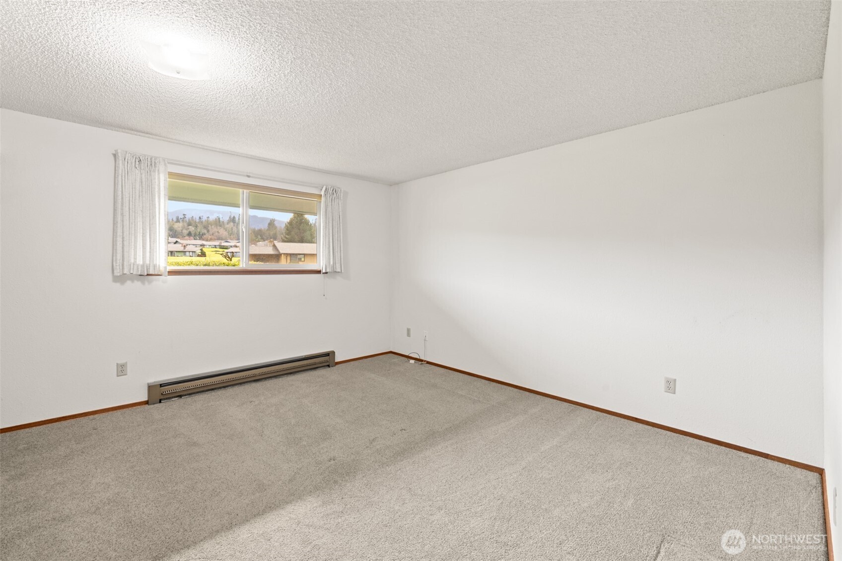 1301 South 3rd Avenue, Unit 28A Sequim, WA 98382 - Photo 18 of 40 an empty room with a window