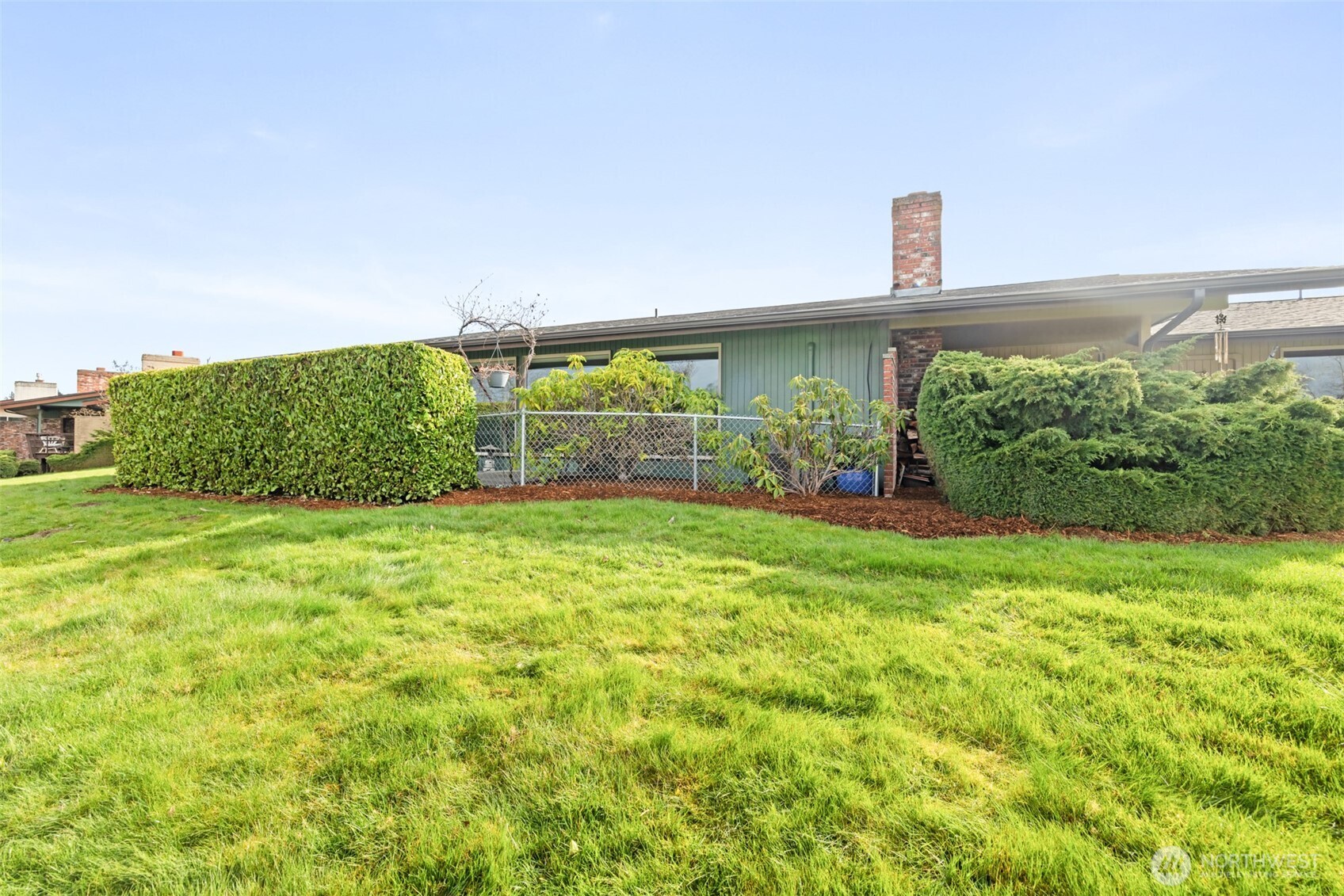 1301 South 3rd Avenue, Unit 28A Sequim, WA 98382 - Photo 34 of 40 a front view of a house with garden