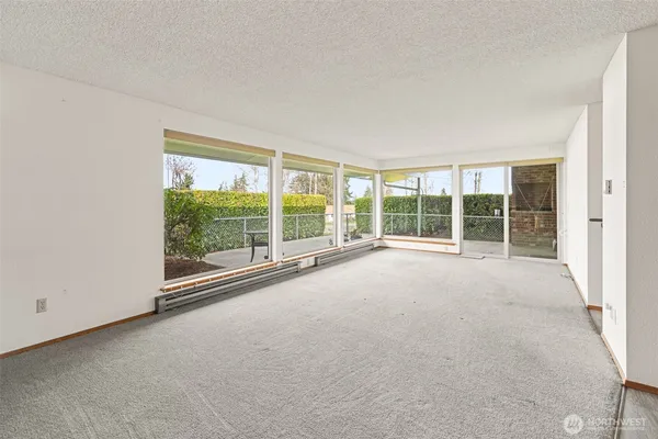 a view of an empty room with a large window