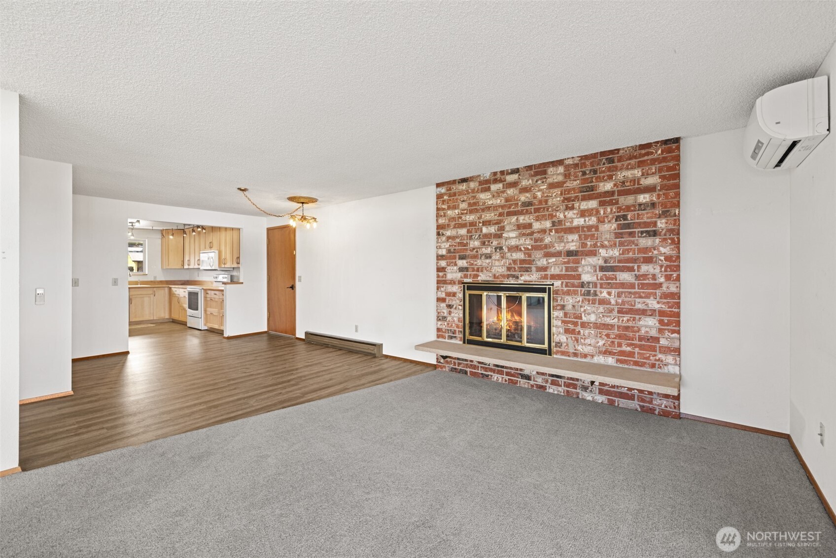 1301 South 3rd Avenue, Unit 28A Sequim, WA 98382 - Photo 5 of 40 a view of an empty room with a fireplace and a window