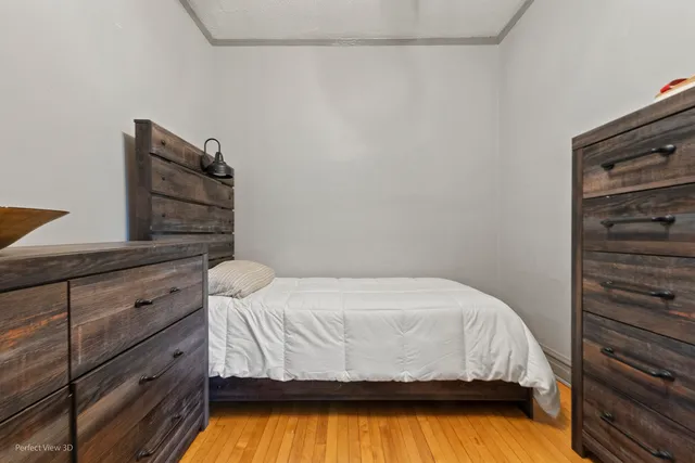 a bedroom with a bed and a cabinets