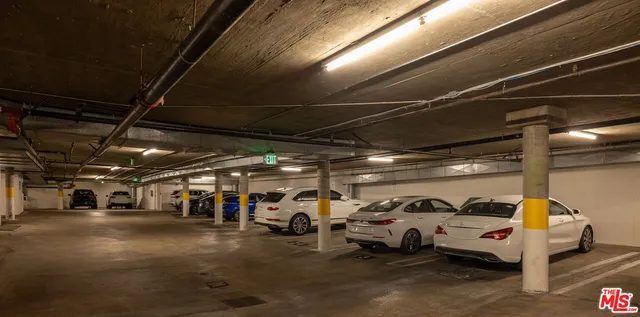 a view of parking garage with cars