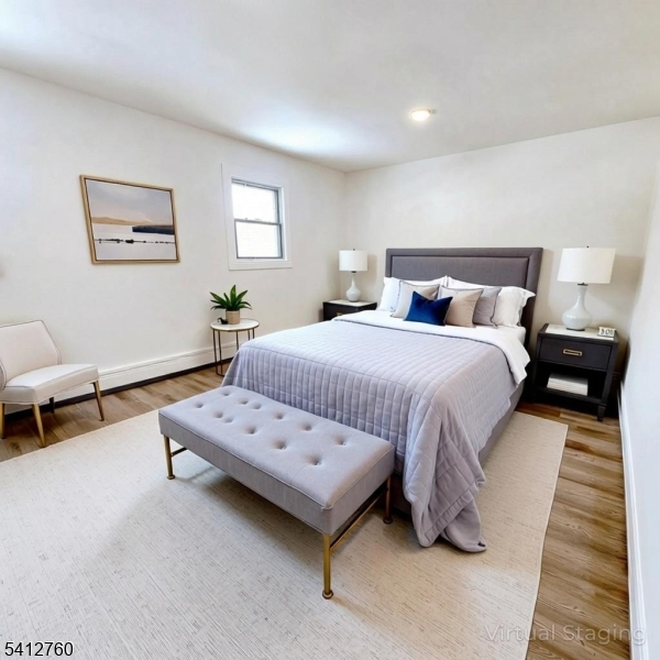 8 Berry Street, Unit 2 Dover, NJ 07801 - Photo 16 of 19 a bedroom with a bed and a lamp on table