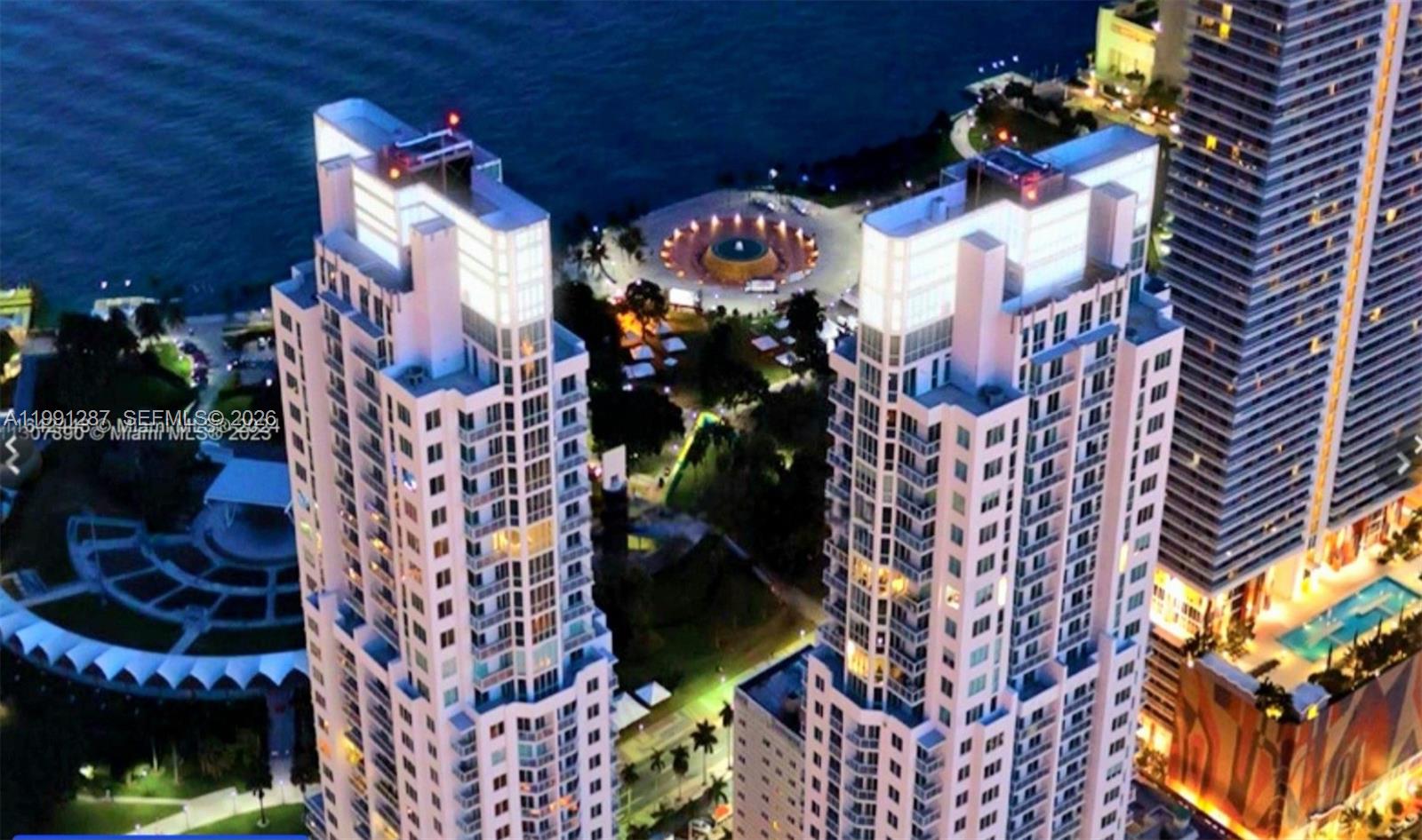 253 Northeast 2nd Street, Unit 905 Miami, FL 33132 - Photo 2 of 20 a view of a house with a flower garden