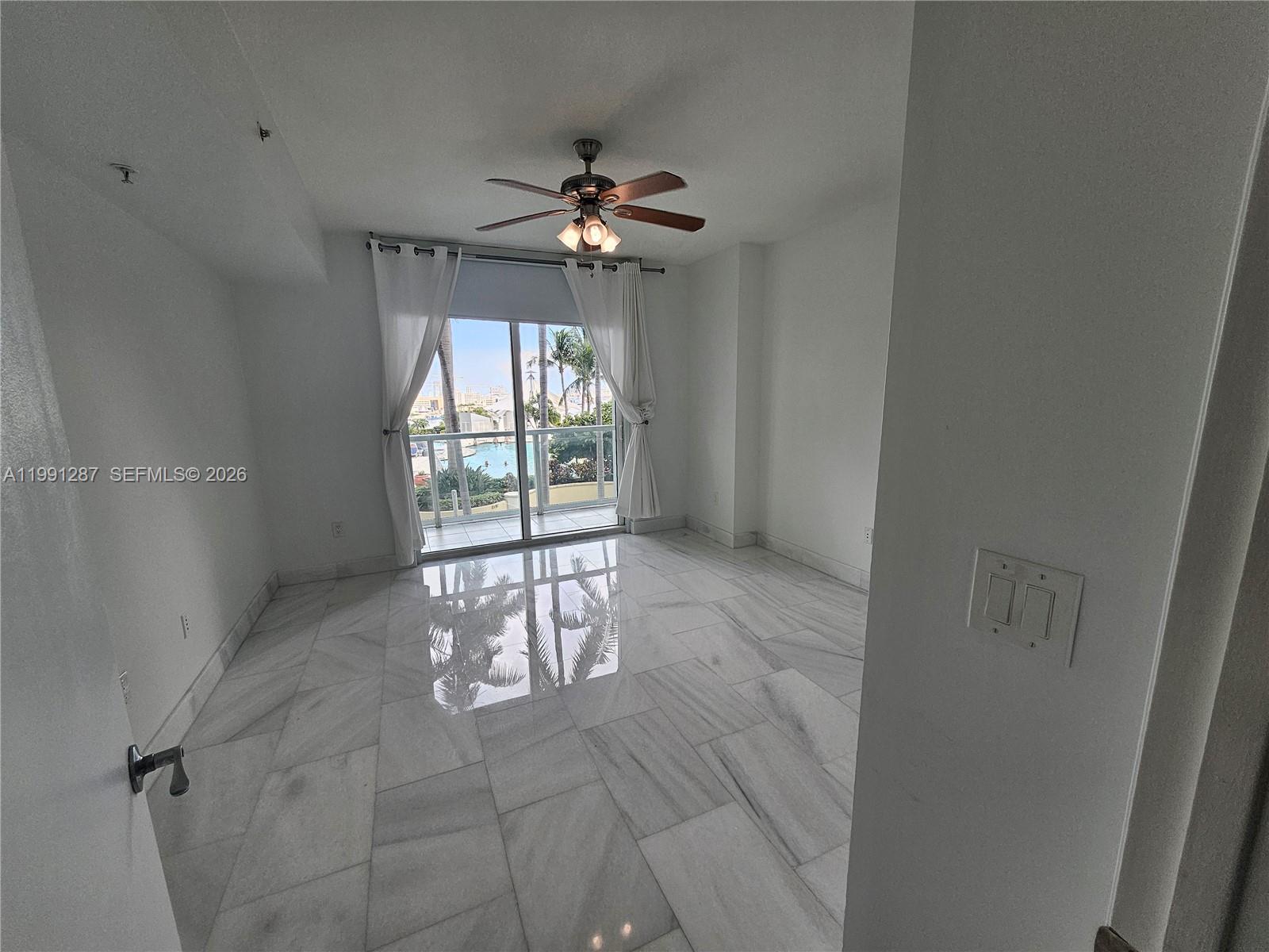 253 Northeast 2nd Street, Unit 905 Miami, FL 33132 - Photo 9 of 20 a view of an empty room with a window