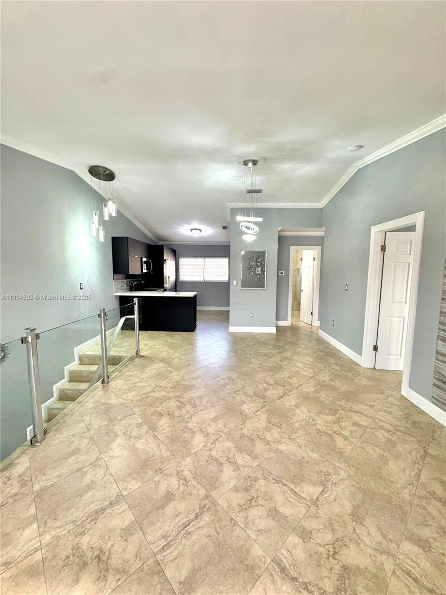 7870 West 29th Way, Unit 201 Hialeah, FL 33018 - Photo 4 of 18 a view of a kitchen with kitchen area and a sink