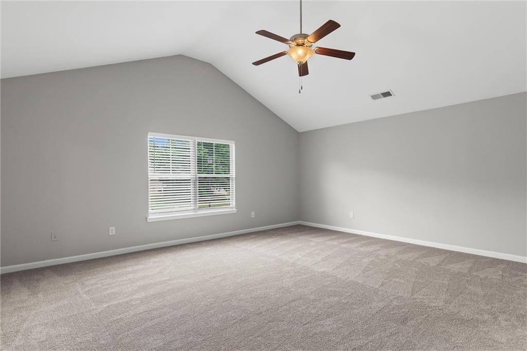 9120 Alden Drive Locust Grove, GA 30248 - Photo 24 of 39 an empty room with a window and a fan