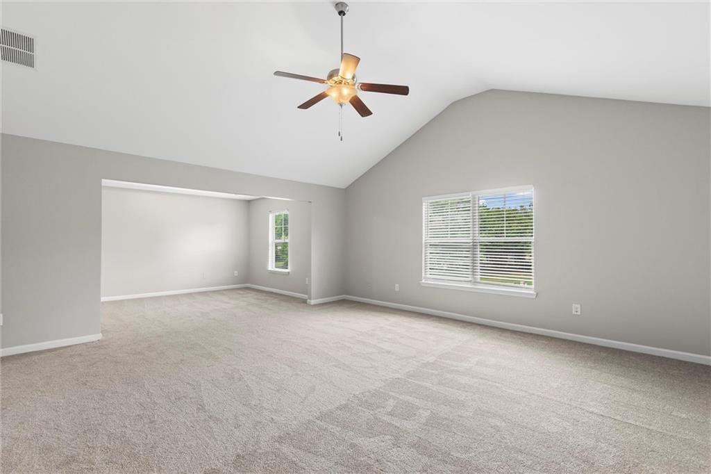 9120 Alden Drive Locust Grove, GA 30248 - Photo 25 of 39 a view of a livingroom with a ceiling fan and window