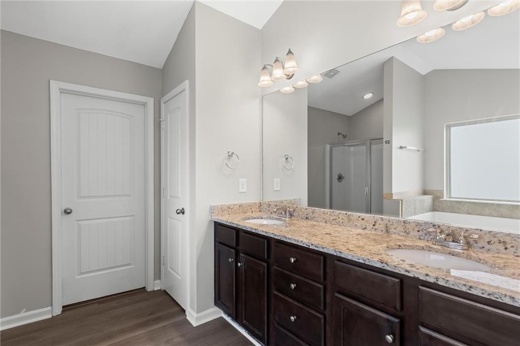 9120 Alden Drive Locust Grove, GA 30248 - Photo 30 of 39 a bathroom with a granite countertop sink and a mirror