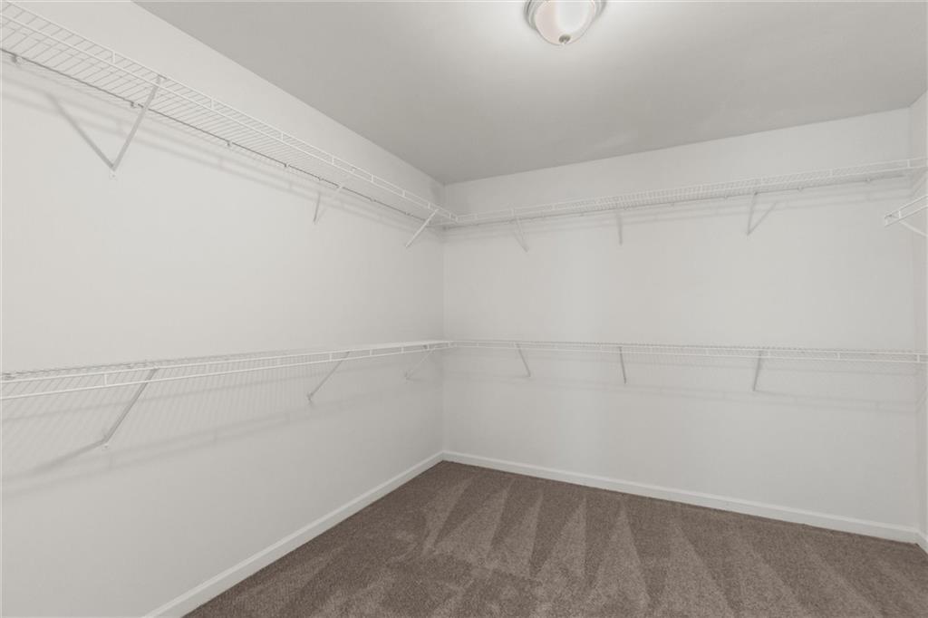 9120 Alden Drive Locust Grove, GA 30248 - Photo 32 of 39 a view of a room with racks on the wall