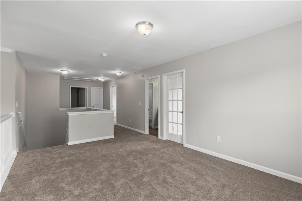 9120 Alden Drive Locust Grove, GA 30248 - Photo 34 of 39 a view of a big room with closet and windows