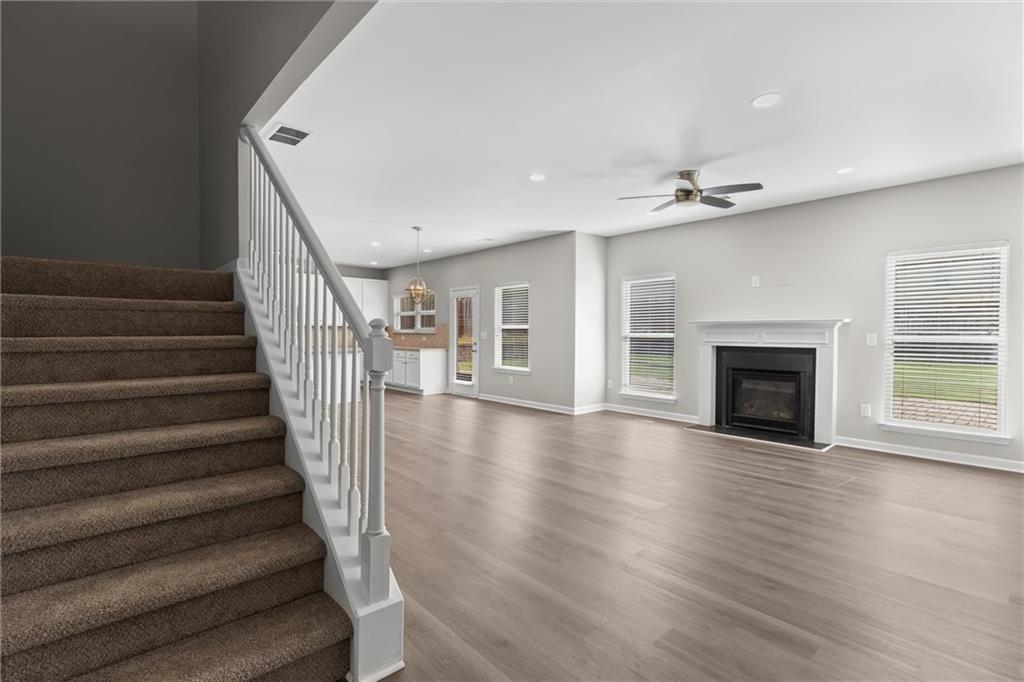 9120 Alden Drive Locust Grove, GA 30248 - Photo 39 of 39 a view of an empty room with wooden floor fireplace and a window