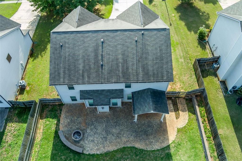 9120 Alden Drive Locust Grove, GA 30248 - Photo 8 of 39 an aerial view of a house with swimming pool and porch