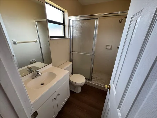 a bathroom with a toilet sink and shower