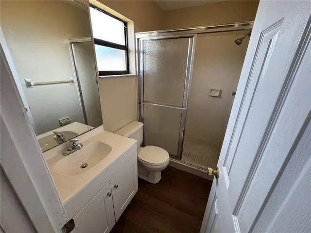 a bathroom with a toilet sink and shower