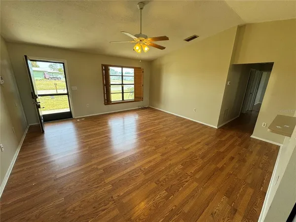 a view of livingroom with window and wooden floor