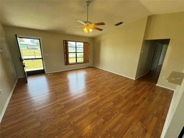 a view of livingroom with window and wooden floor
