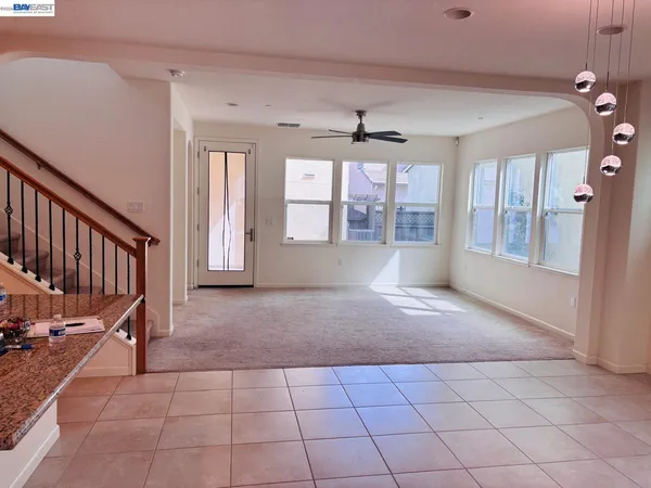 a view of a room with gym equipment and windows