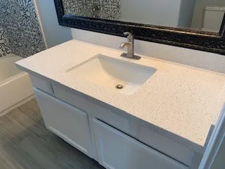 a bathroom with a shower and a sink