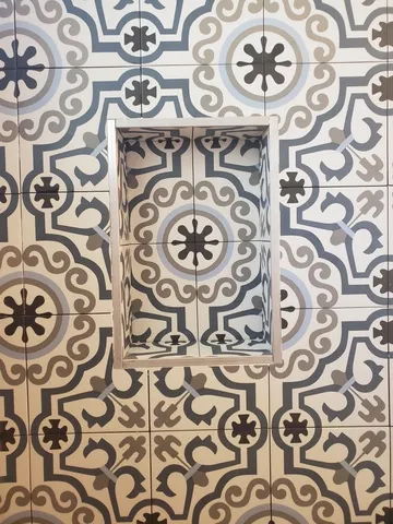 a bathroom with a window and a shower curtain