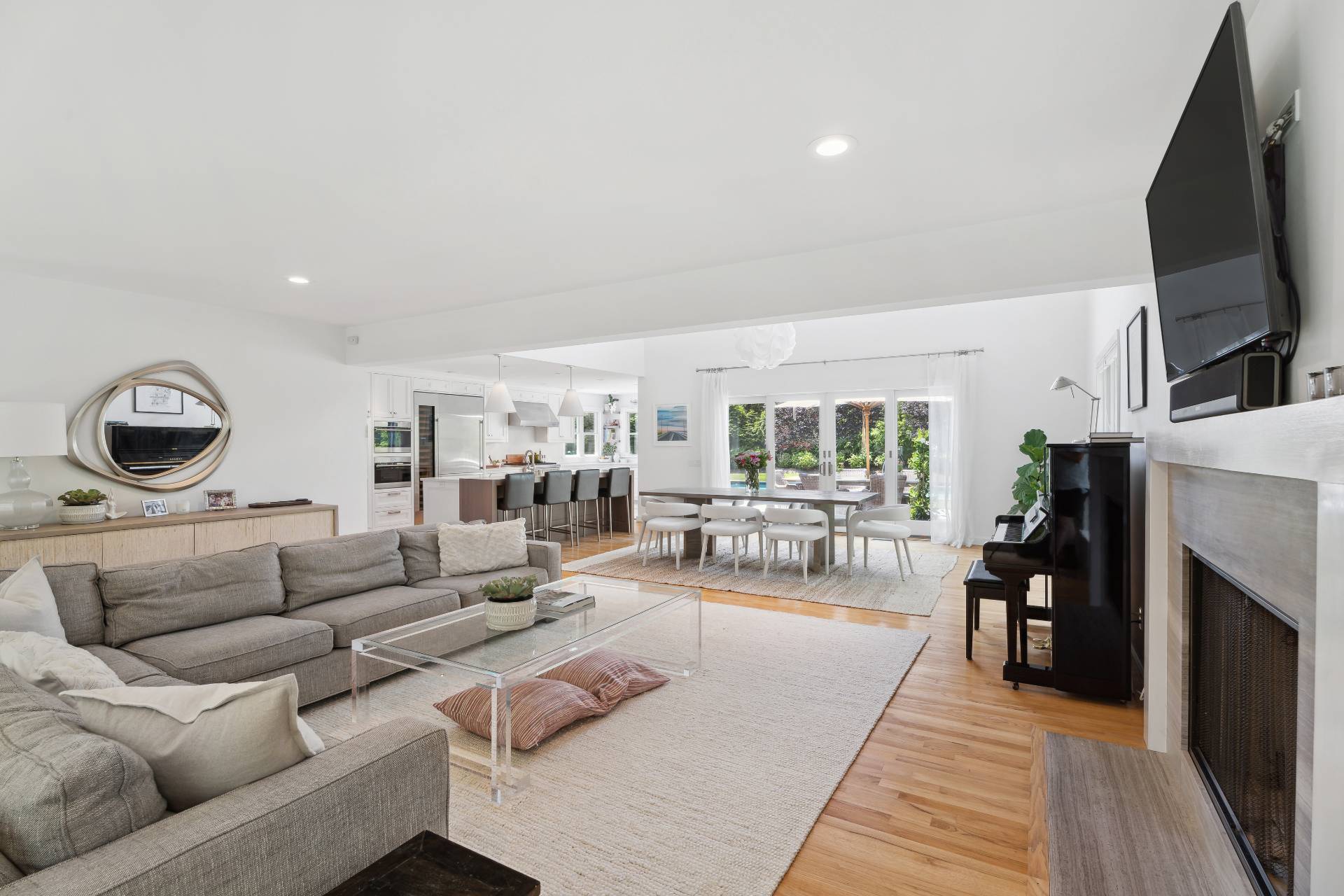 29 Emerson Place Sag Harbor, NY 11963 - Photo 11 of 23 a living room with furniture and a flat screen tv