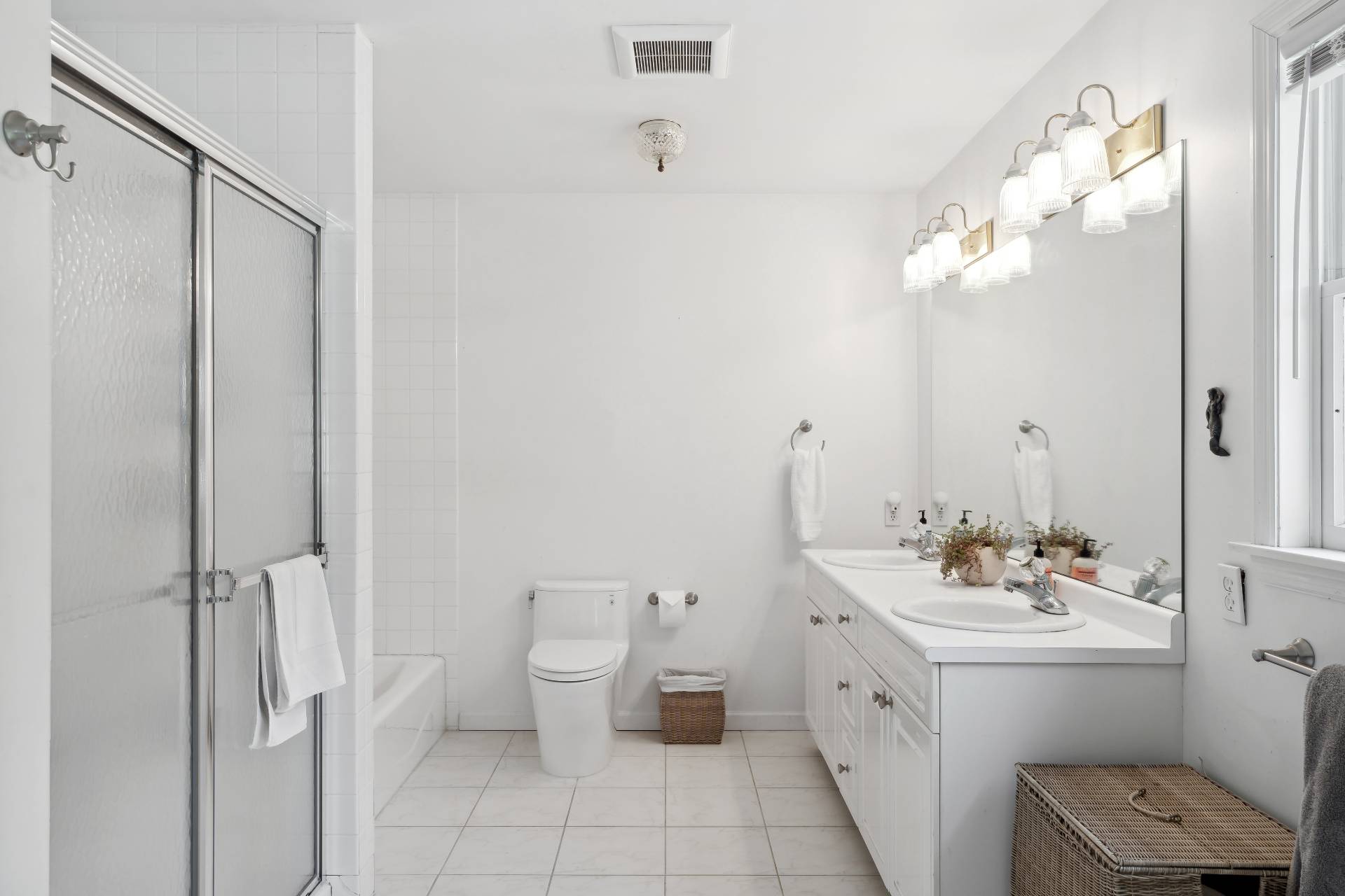 29 Emerson Place Sag Harbor, NY 11963 - Photo 15 of 23 a bathroom with a double vanity sink mirror and toilet