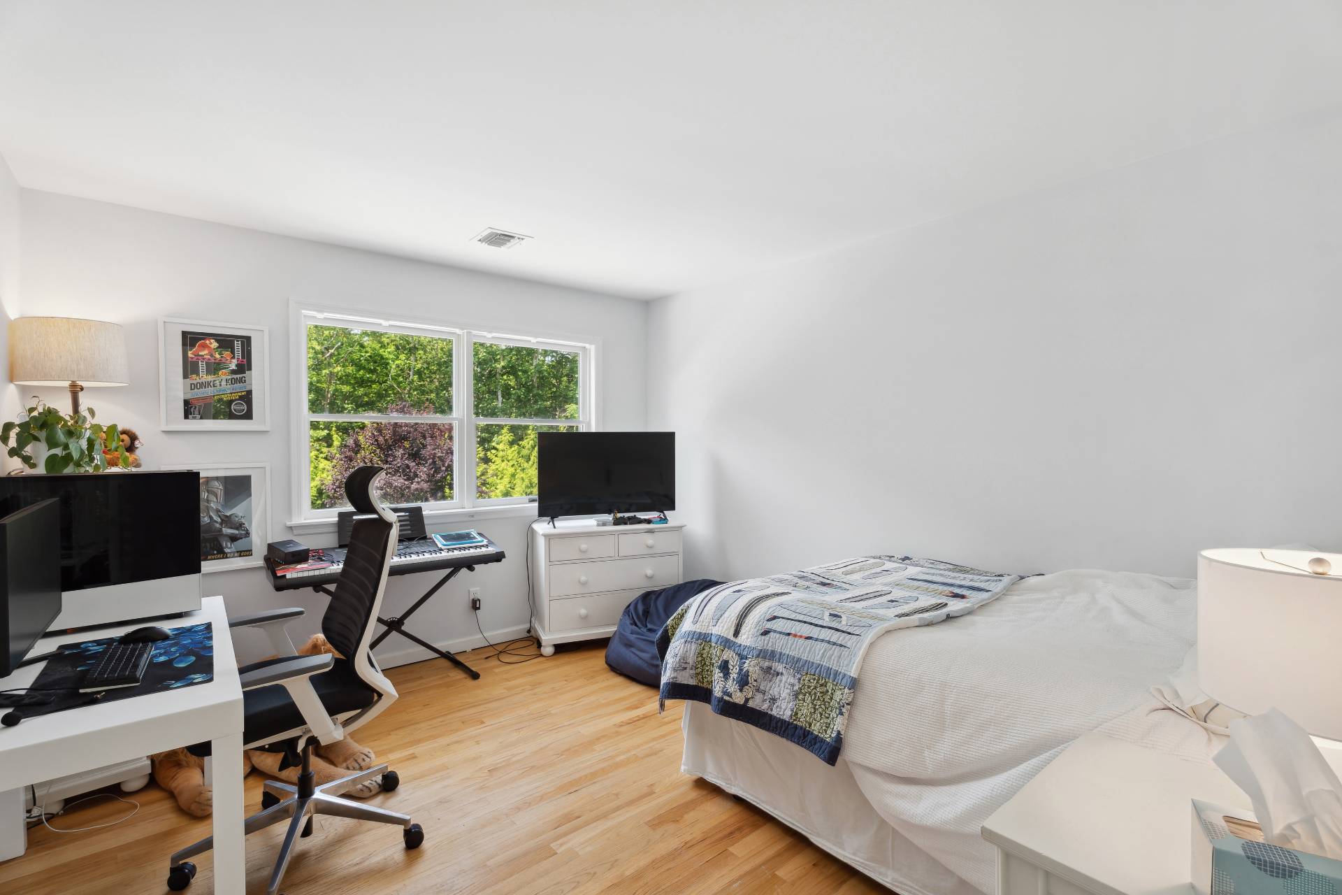 29 Emerson Place Sag Harbor, NY 11963 - Photo 17 of 23 a bedroom with a bed and a flat screen tv