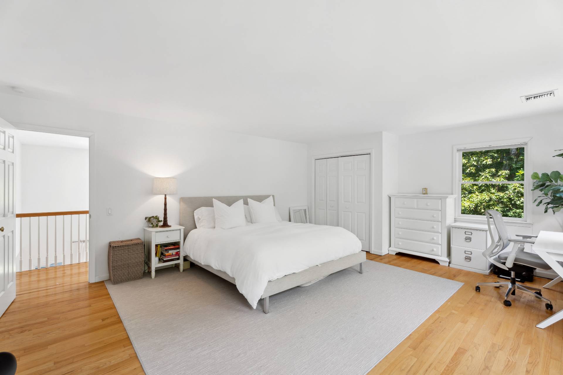 29 Emerson Place Sag Harbor, NY 11963 - Photo 18 of 23 a bedroom with a bed chair and a window