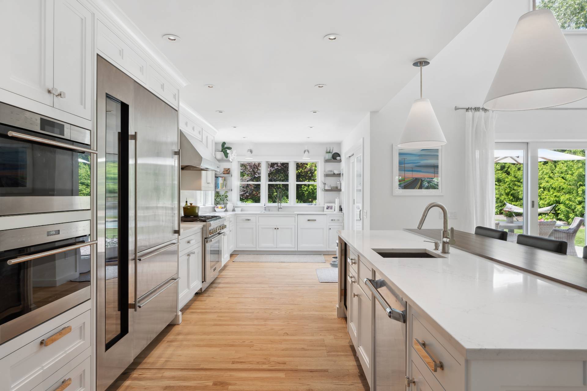 29 Emerson Place Sag Harbor, NY 11963 - Photo 5 of 23 a kitchen with a sink stove and refrigerator