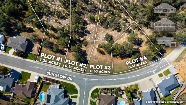 an aerial view of a house with a mountain