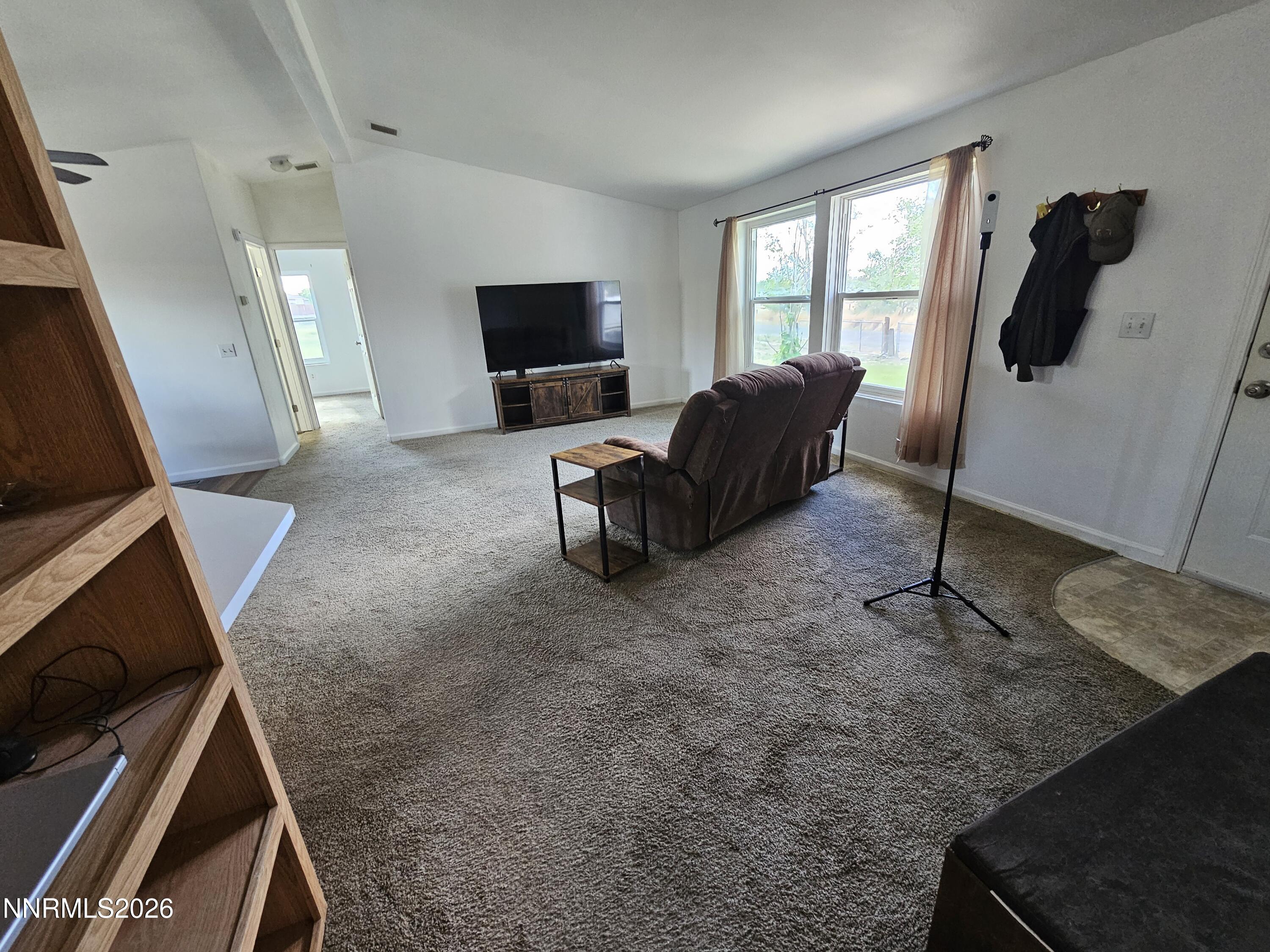 1125 Rancho Road Fernley, NV 89408 - Photo 10 of 47 a living room with furniture and a flat screen tv