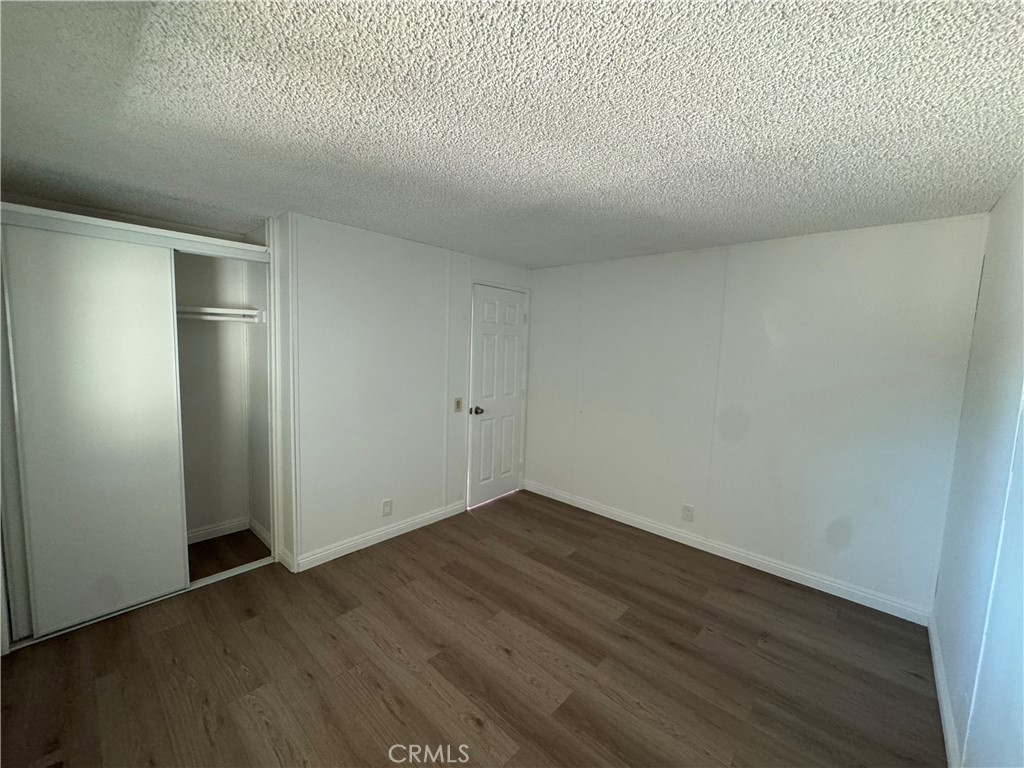 37065 Bonita Vista Road Anza, CA 92539 - Photo 25 of 65 an empty room with wooden floor