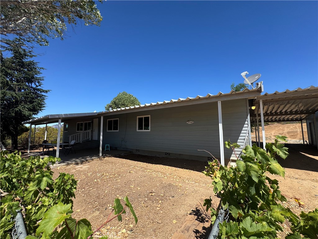 37065 Bonita Vista Road Anza, CA 92539 - Photo 3 of 65 a front view of a house with a yard and garage