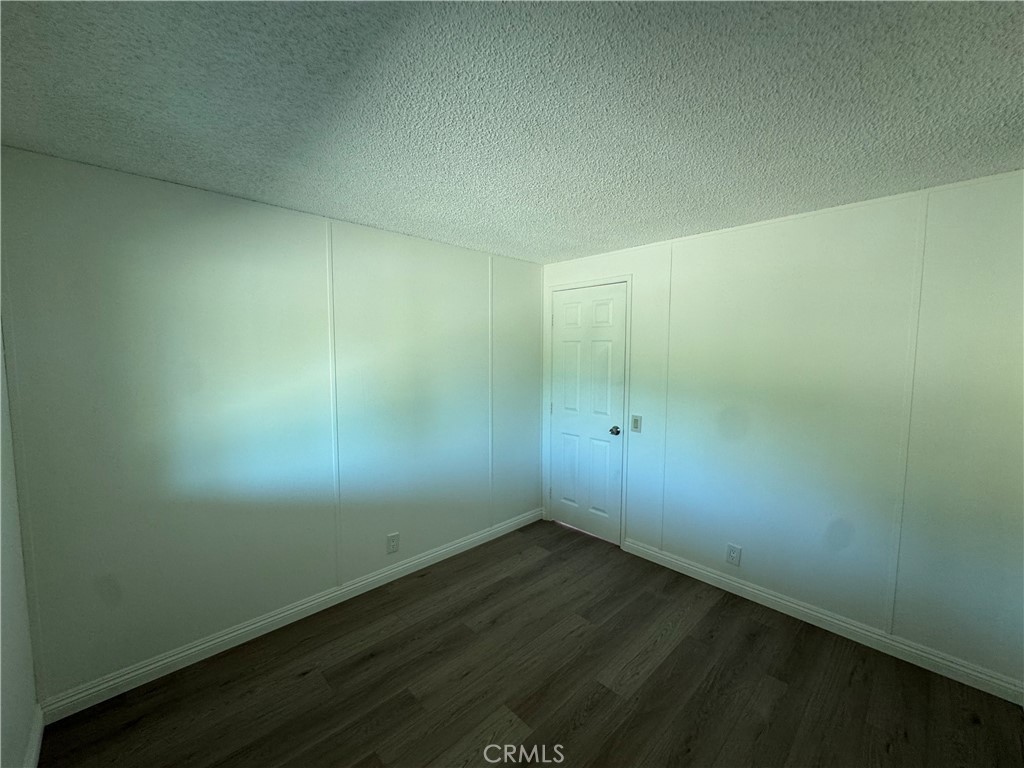 37065 Bonita Vista Road Anza, CA 92539 - Photo 31 of 65 an empty room with wooden floor and windows