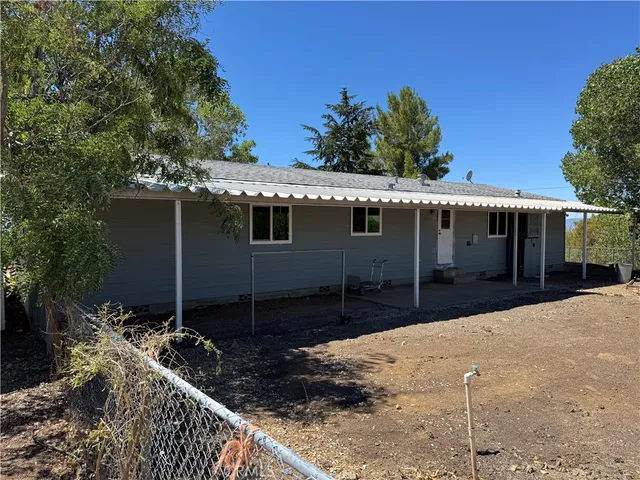 a view of an empty room with wooden walls
