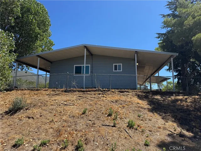 a outside view of a house with a yard