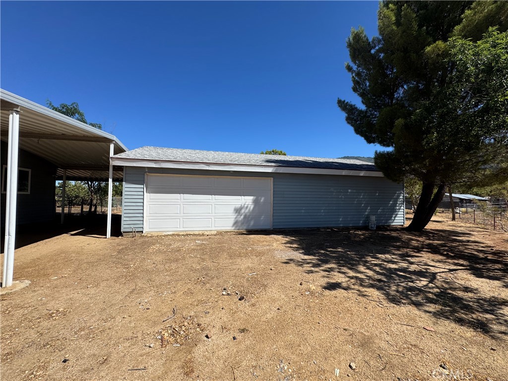 37065 Bonita Vista Road Anza, CA 92539 - Photo 4 of 65 a view of yellow house with street next to a yard