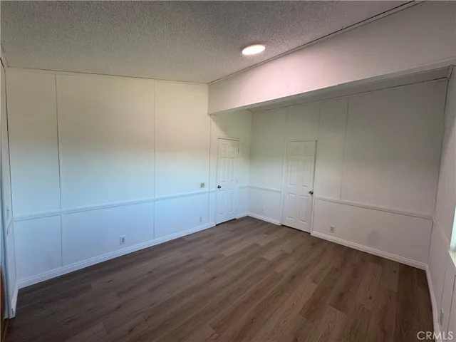 an empty room with wooden floor
