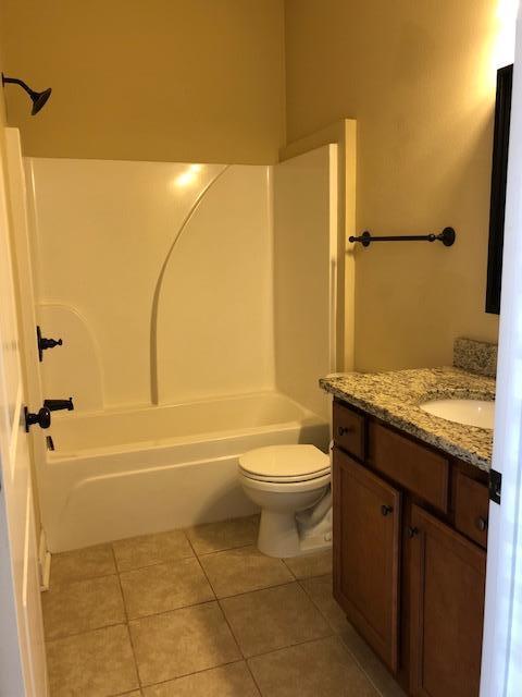 439 Indian Woman Road Santa Rosa Beach, FL 32459 - Photo 5 of 9 a bathroom with a granite countertop sink toilet and shower