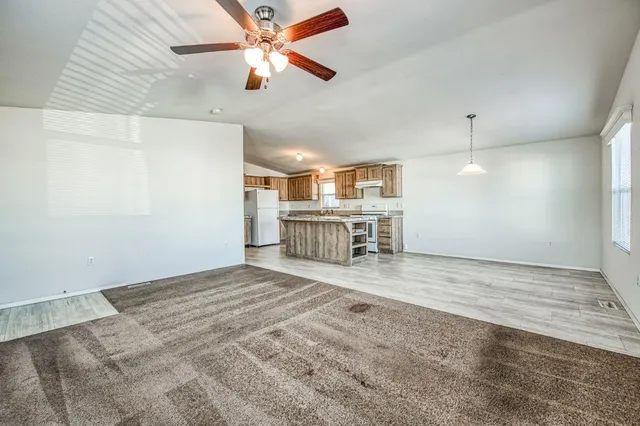 a view of a kitchen with a sink and a kitchen view