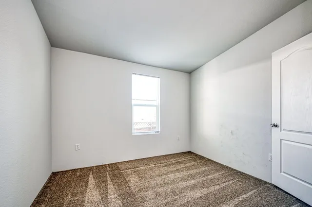 a view of an empty room and window