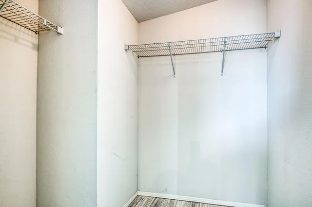 a view of a room with racks on the wall