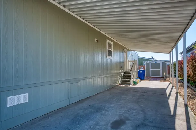 a view of an empty room with wooden walls