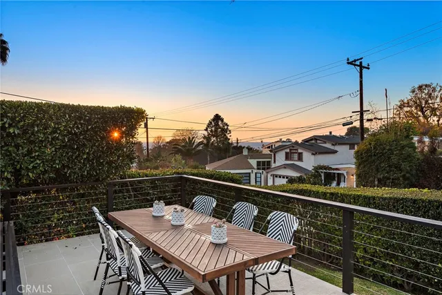 a view of a balcony with furniture