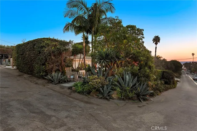 a view of a street with a building in the background
