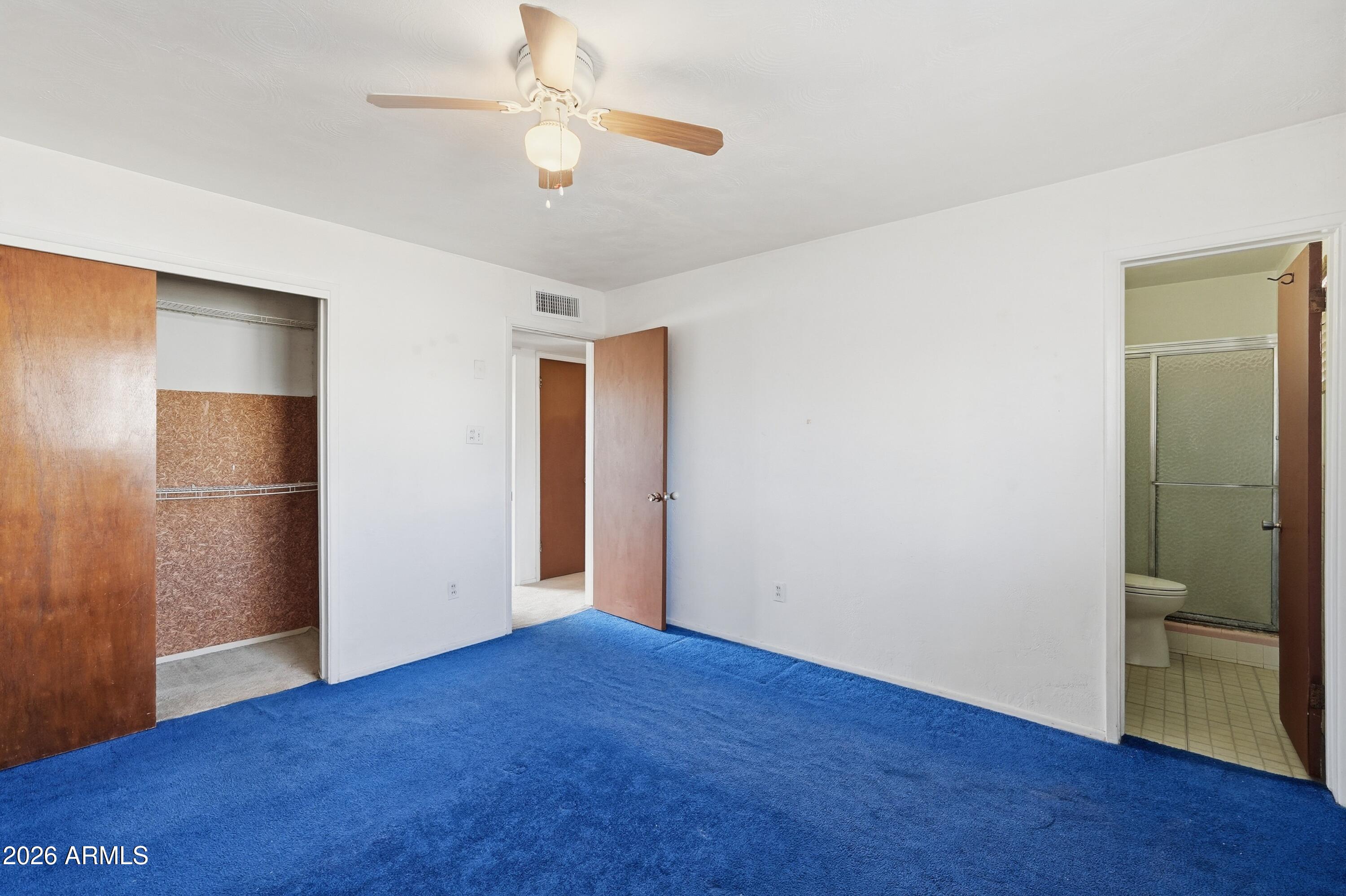 1120 West Romo Jones Street Tempe, AZ 85281 - Photo 11 of 18 a view of an empty room with wooden floor