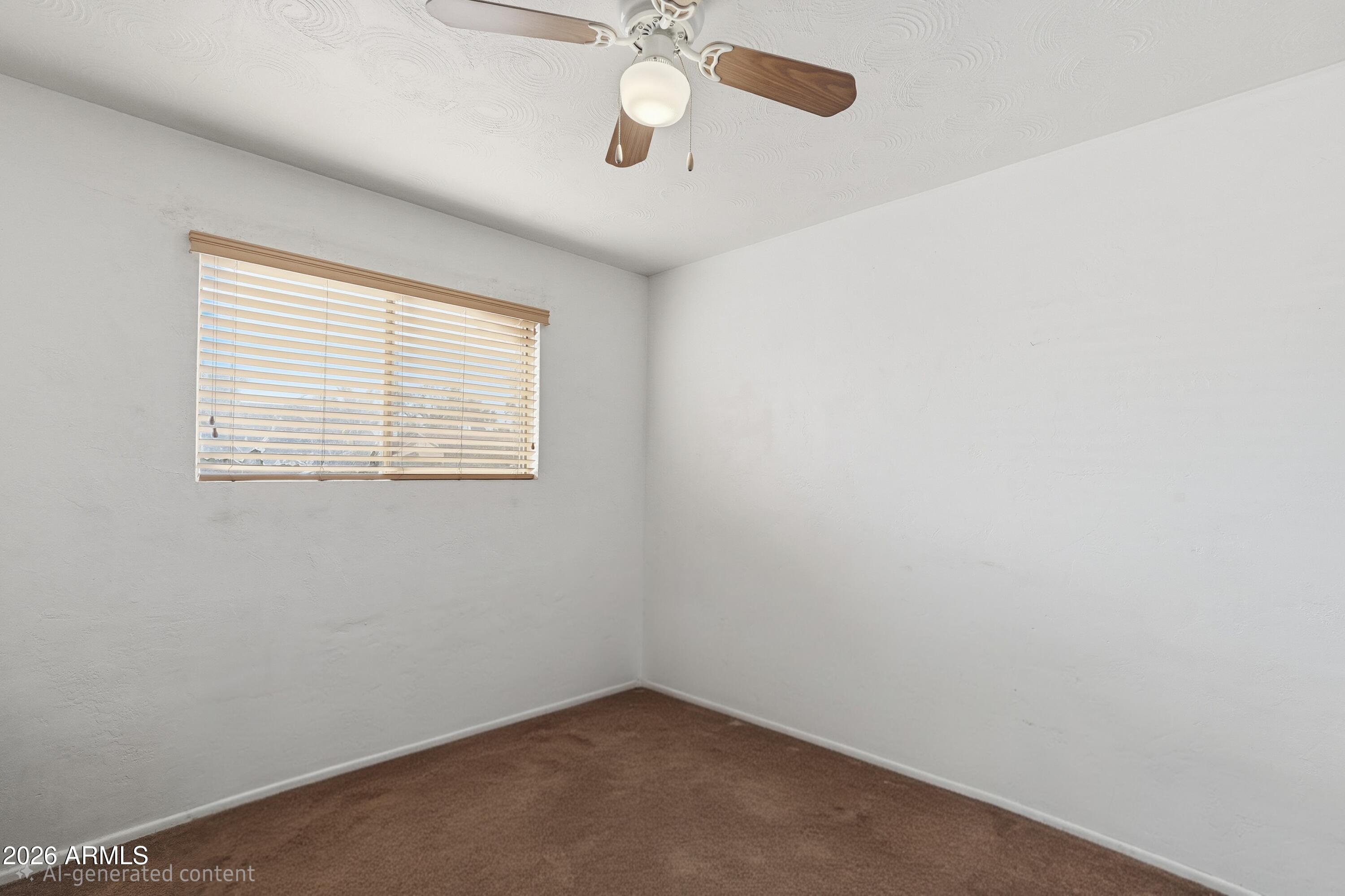 1120 West Romo Jones Street Tempe, AZ 85281 - Photo 14 of 18 an empty room with windows