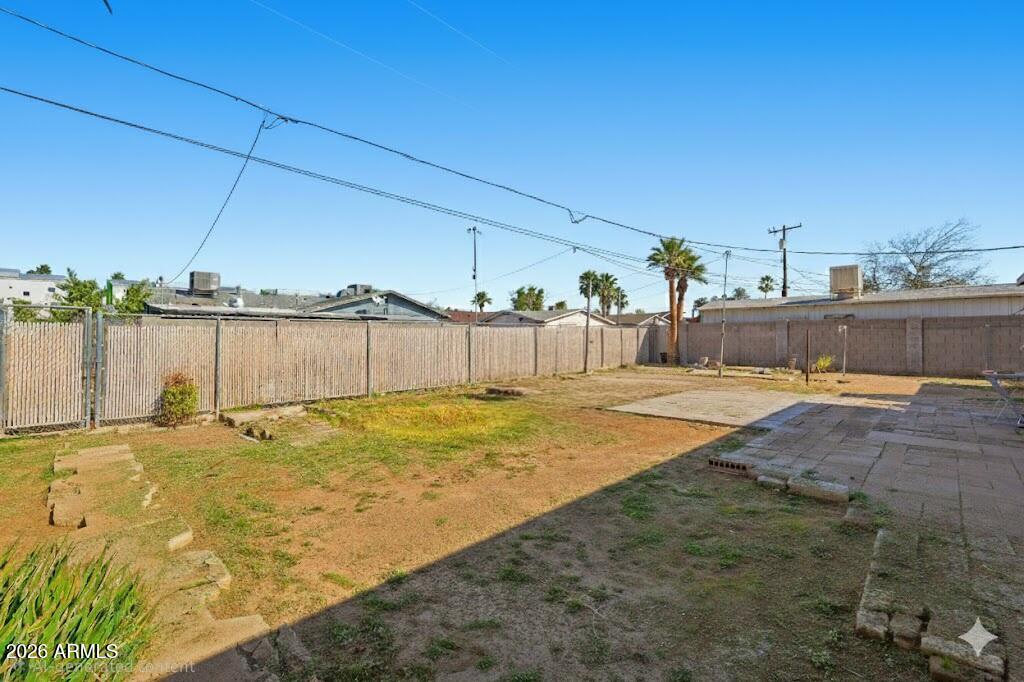 1120 West Romo Jones Street Tempe, AZ 85281 - Photo 17 of 18 a swimming pool with a yard