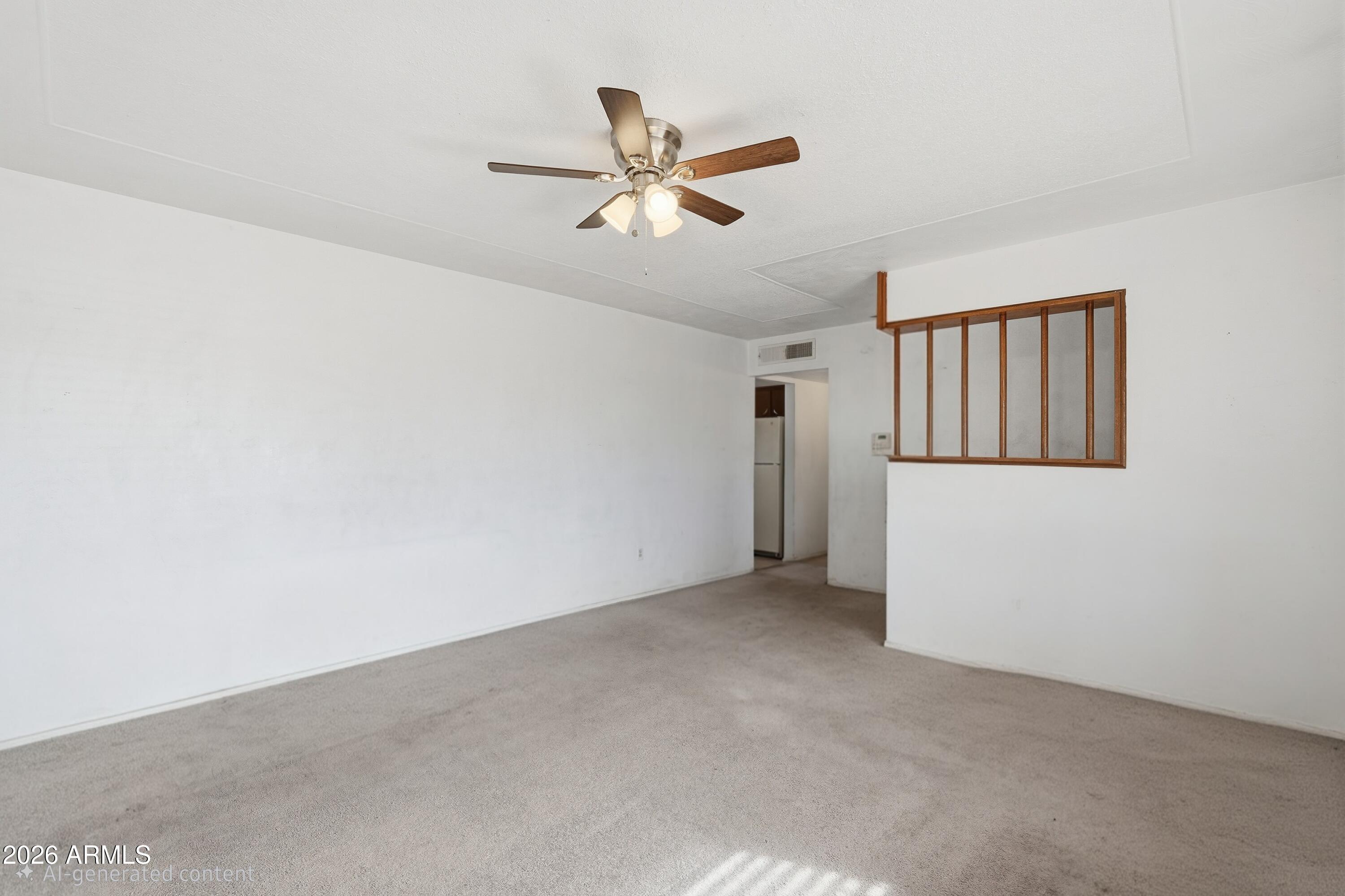 1120 West Romo Jones Street Tempe, AZ 85281 - Photo 4 of 18 a view of a livingroom with a ceiling fan and window