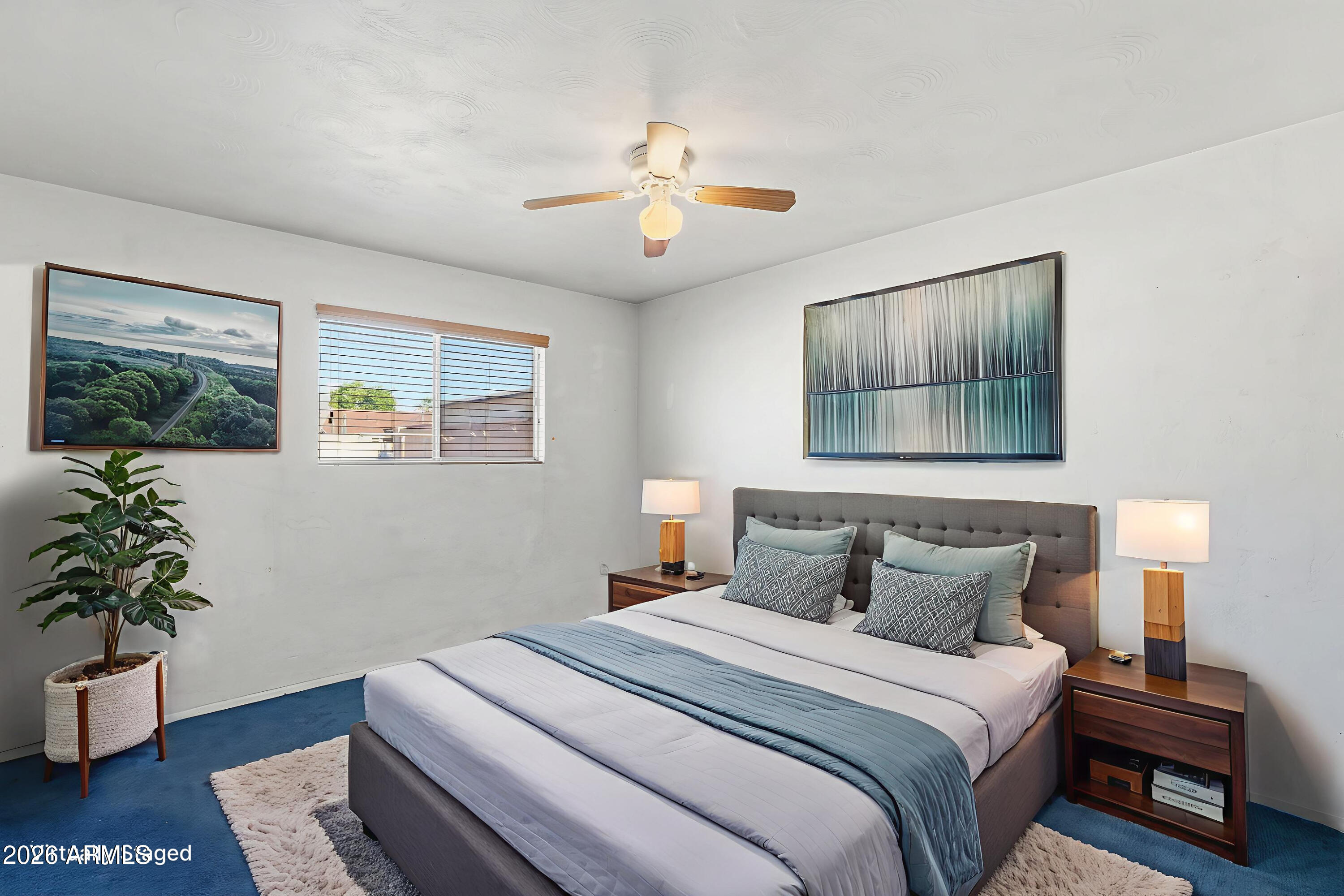 1120 West Romo Jones Street Tempe, AZ 85281 - Photo 10 of 18 a bedroom with a bed and a potted plant